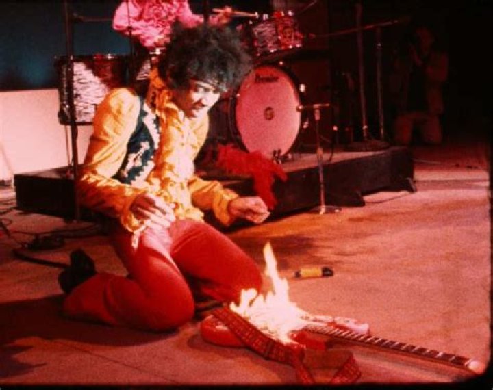 Did Hendrix burn his guitar at Woodstock?