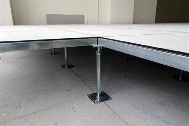 How can you tell if a concrete floor is dry?