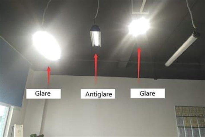 How do you reduce glare from overhead fluorescent lights?