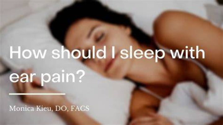 How should I sleep with ear pain?