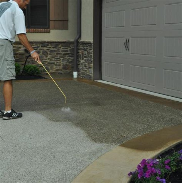 Should I spray or roll concrete sealer?