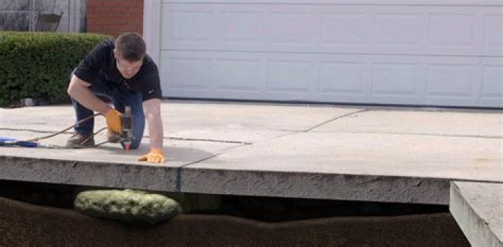 Should you put plastic under concrete driveway?