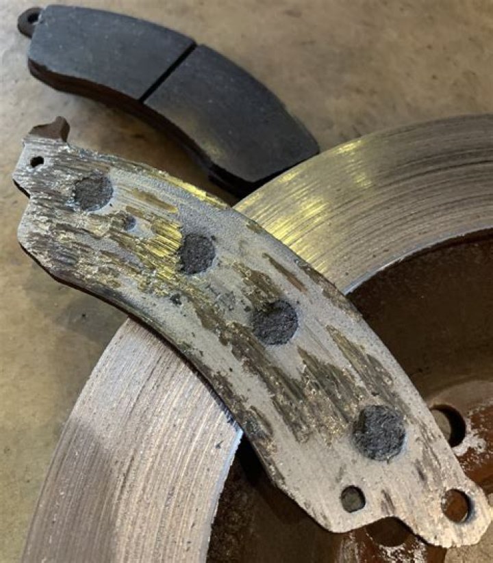 What are the signs of worn brake pads?