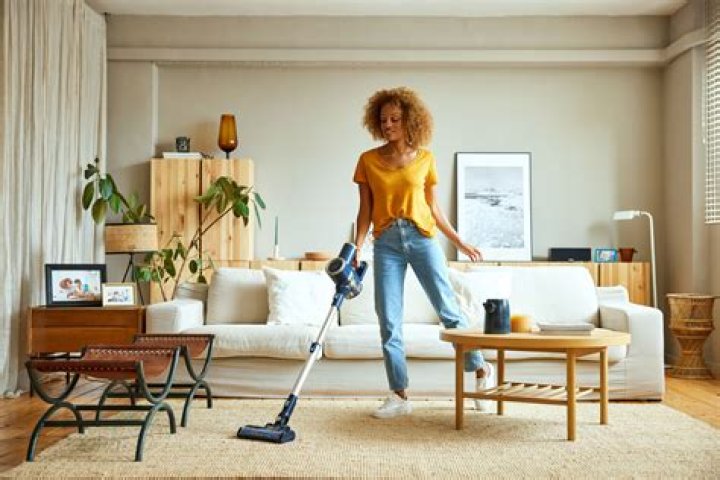 What is the correct motion in vacuuming the carpet?
