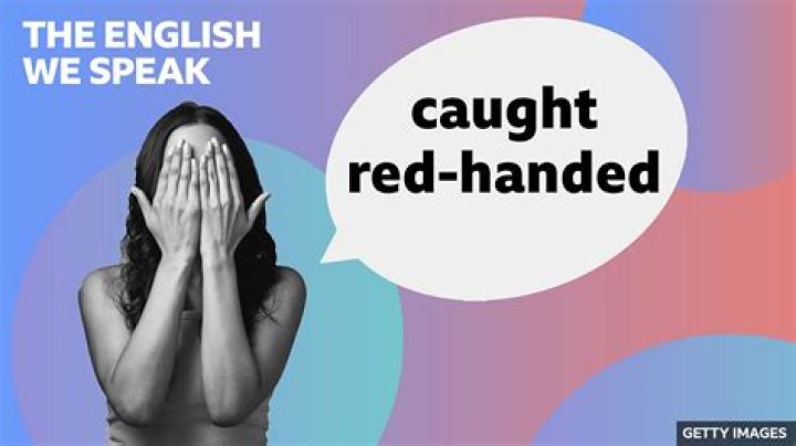 What is the meaning of red handed in English?