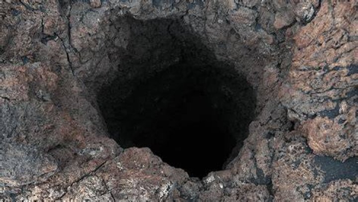 What would happen if you drilled a hole through the Earth and dropped a stone?