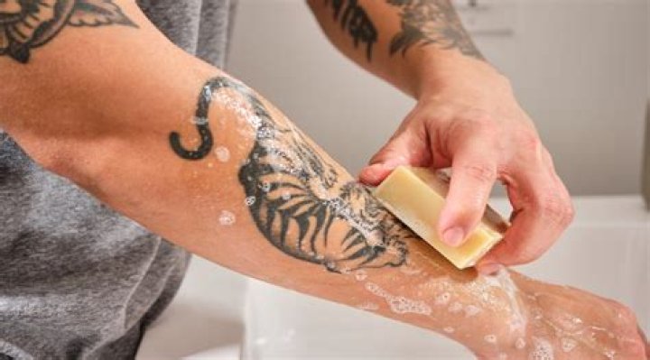 When can I stop washing my tattoo?
