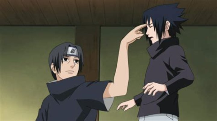 Why did Itachi pokes Sasuke forehead?