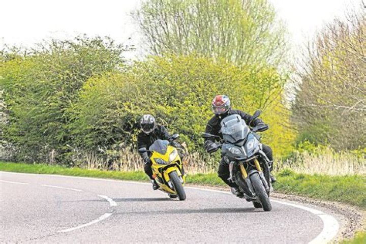 Why do motorcyclists rev their engines?