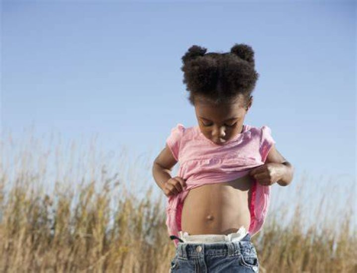 Why does my daughter play with her belly button?