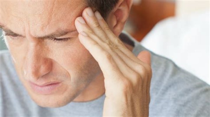 Why does my head hurt when I use my cell phone?
