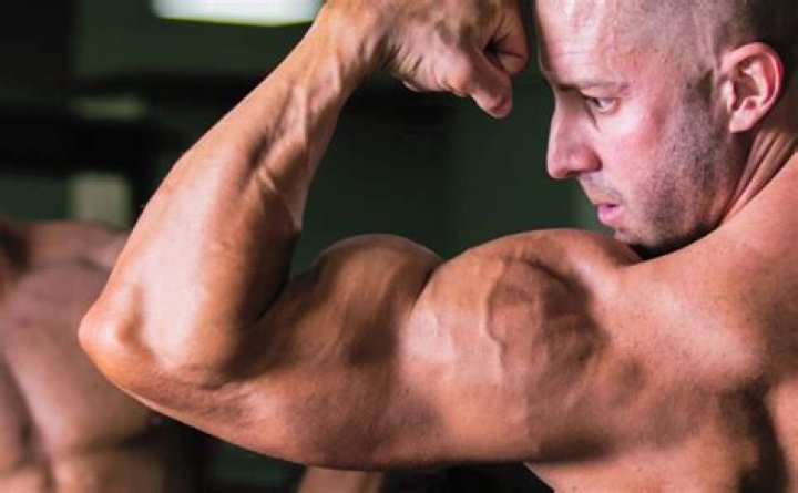 Will lifting heavy weights make my arms bigger?